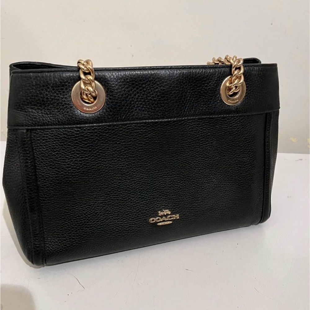 Coach authentic leather purse with straps.